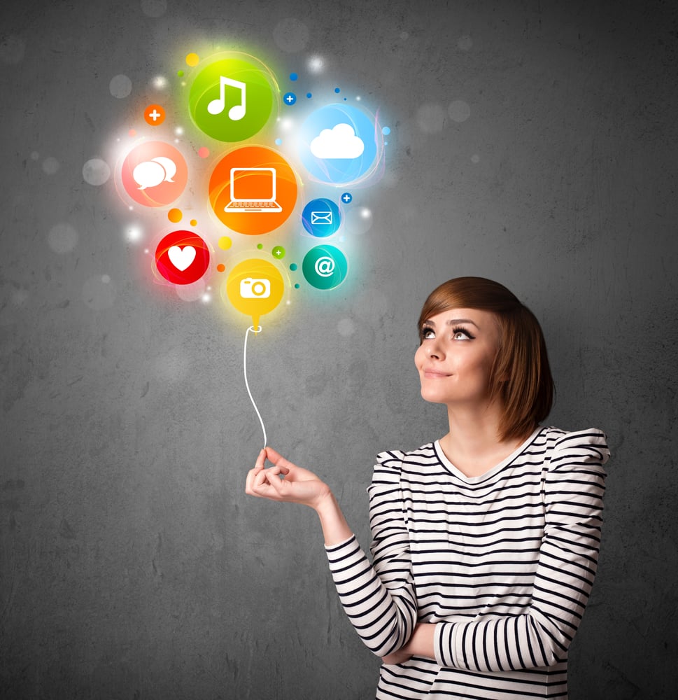Pretty young woman holding colorful social media icons balloon Pretty young woman holding colorful social media icons balloon