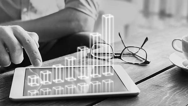 An image of a person tapping on a screen with a graph An image of a person tapping on a screen with a graph