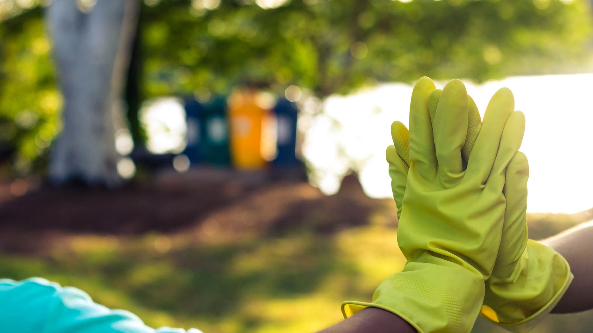 An image of two gloved hands in a high five