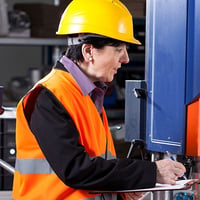 An image of a woman in a factory